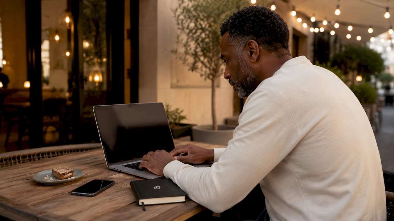 Business owner reviewing booking website on laptop