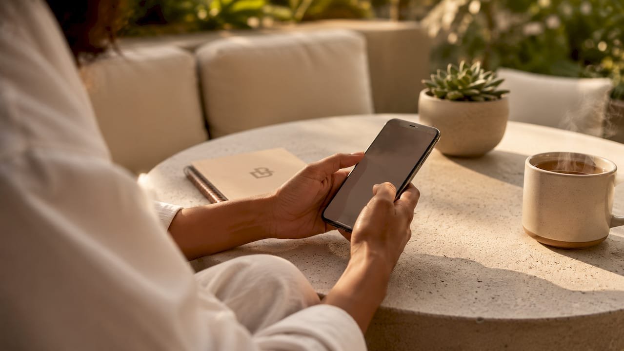 Client hands booking beauty appointment on phone