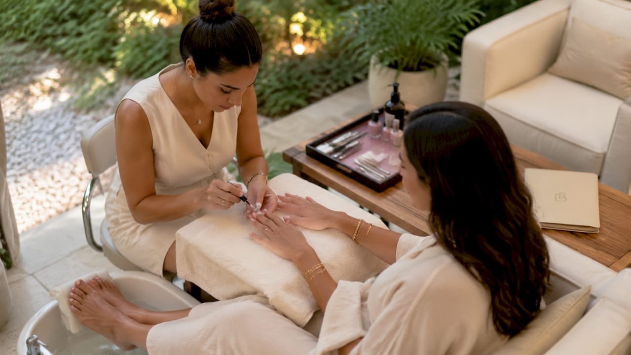 Hands during manicure pedicure combo service